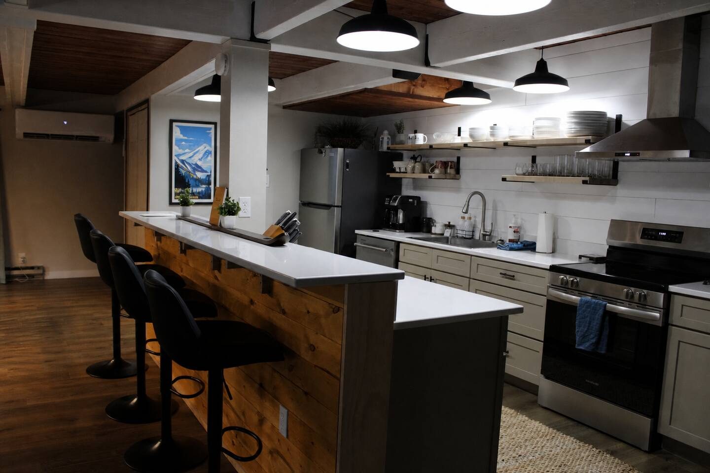 Full kitchen with island bar seating at Tall Timber