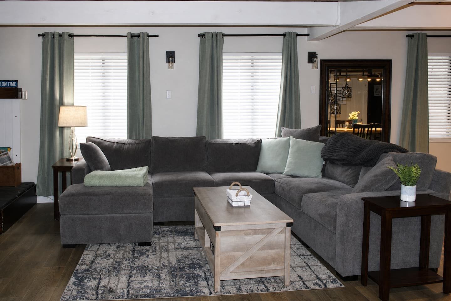 Bright living room with sectional sofa at Tall Timber