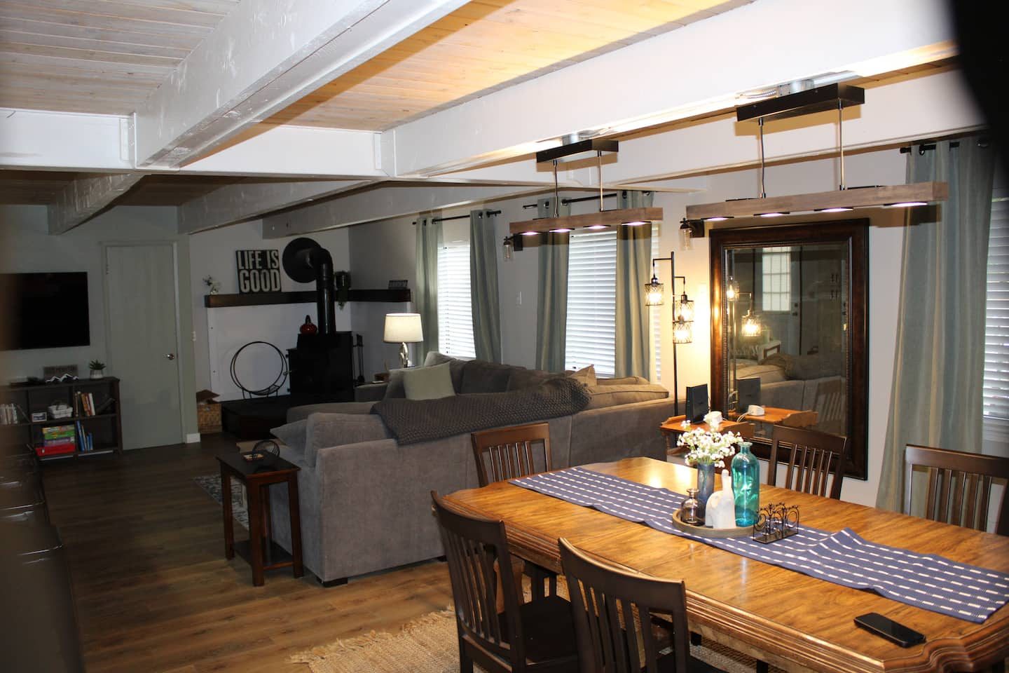 Dining and living area with mini-split heating and cooling at Tall Timber