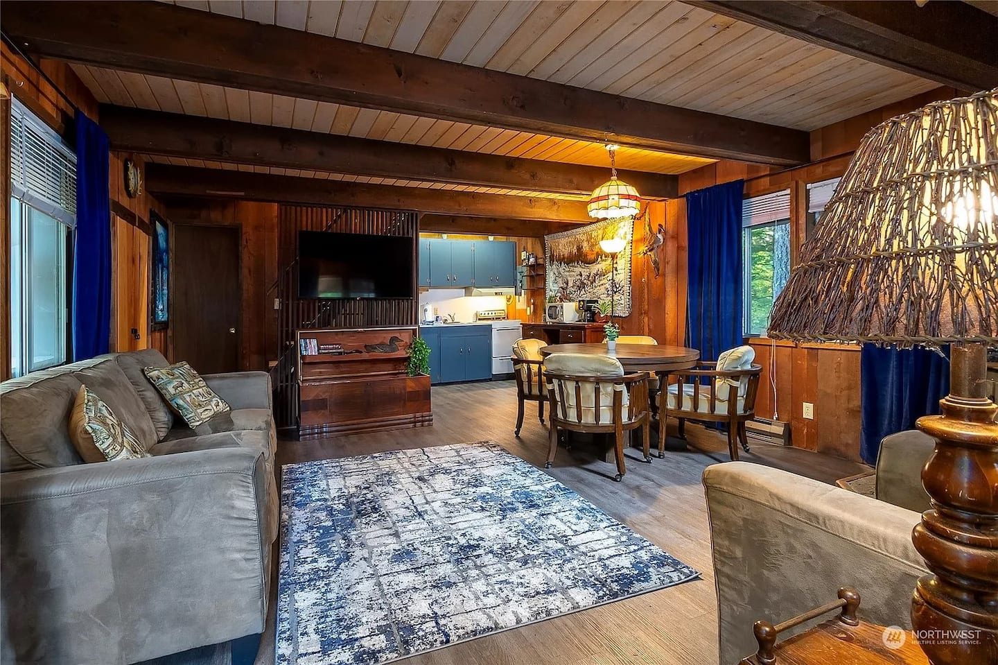 Cozy wood-paneled living room at Tiny Timber